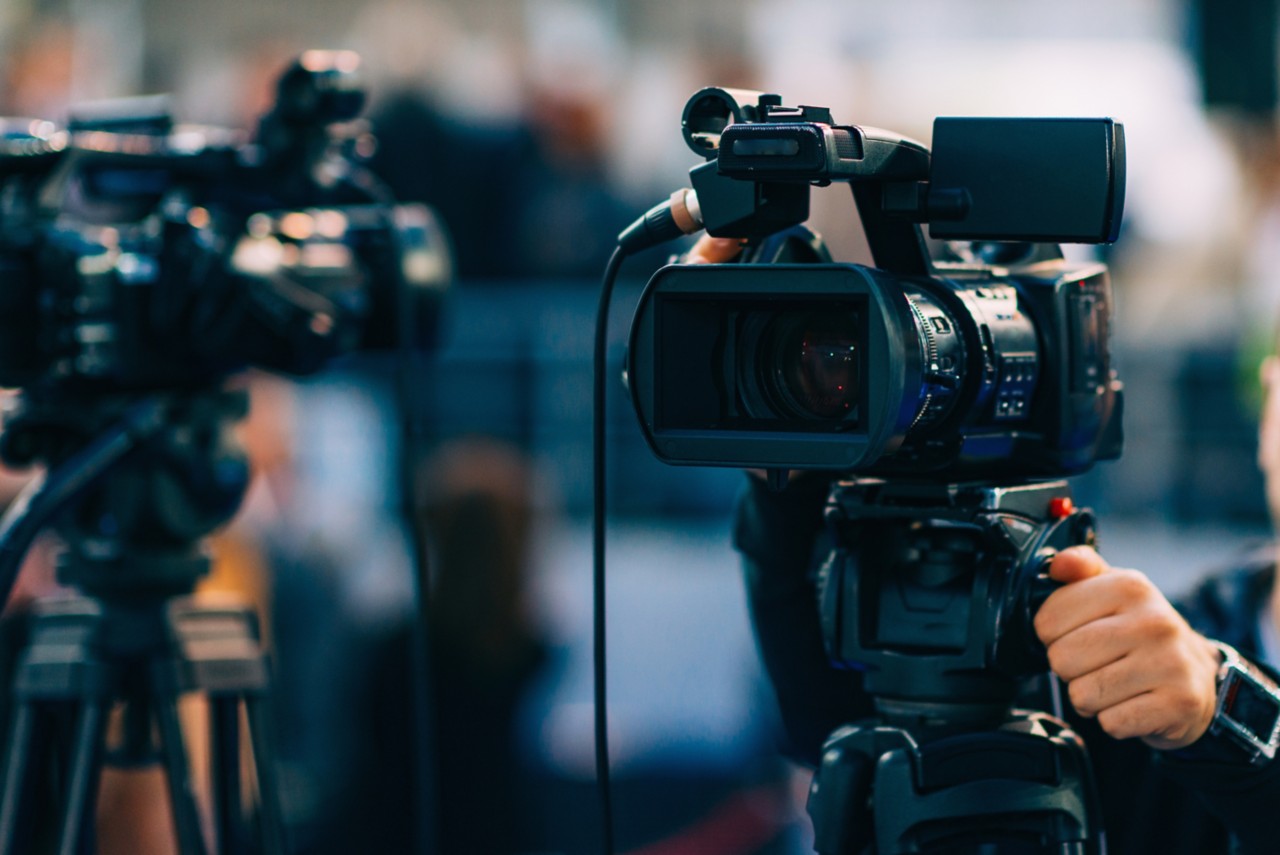 tv cameras filming a media event video recording